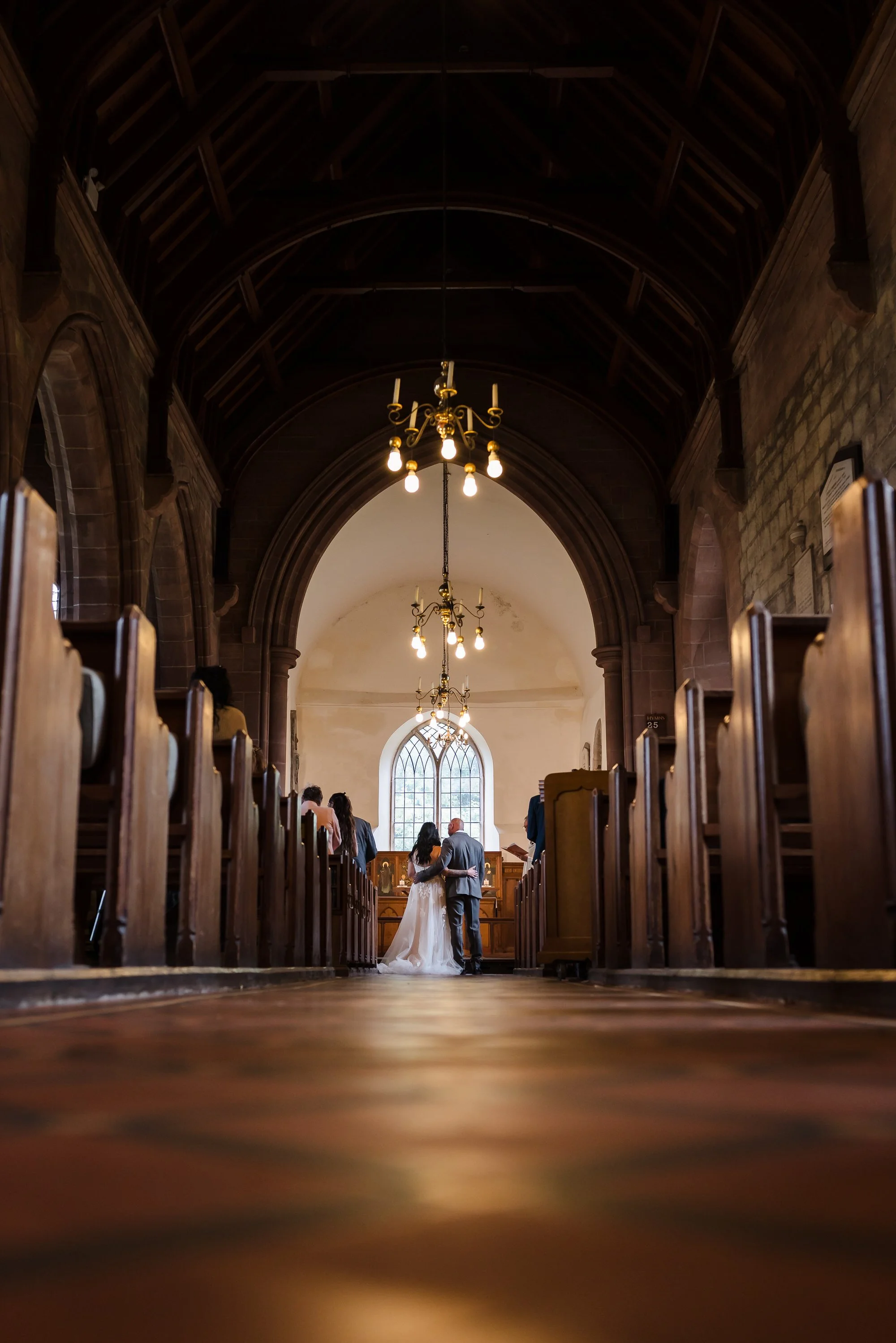 Wide view down the aisle during the ceremony at St Bartholomew's Church, Stourport-on-Severn.
