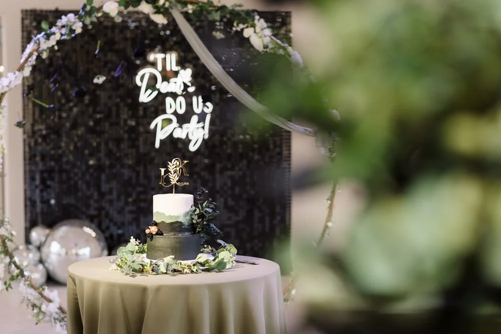 Gothic themed wedding cake with 'Til Death Do Us Party' sign and black sequin backdrop, Arley House wedding photography by Once in a Lifetime Photography