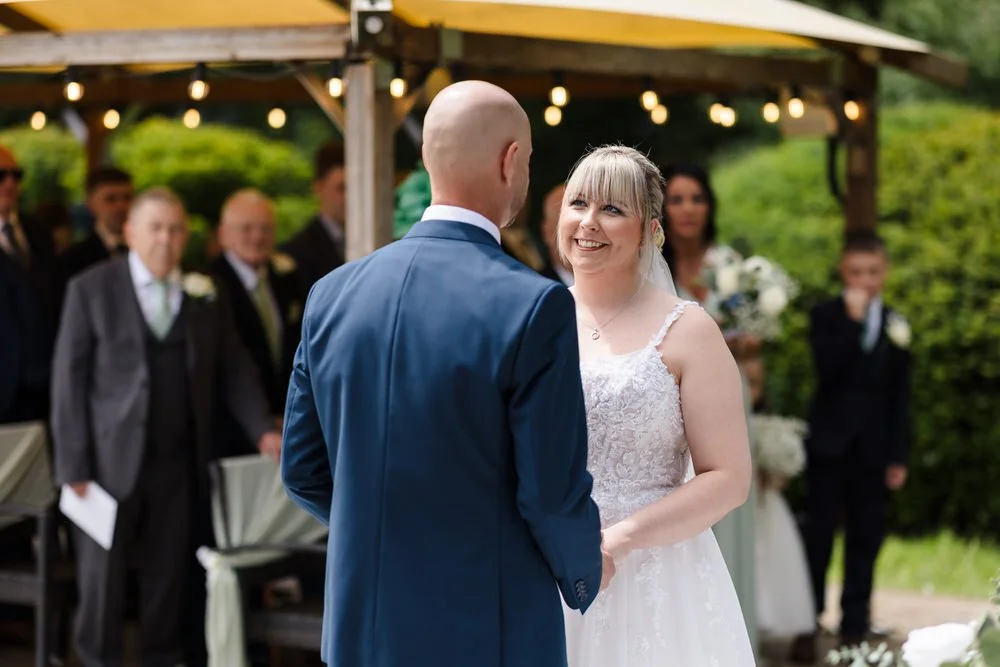 Outdoor wedding ceremony in the Pump Rooms at Hogarths Stone Manor, Worcestershire