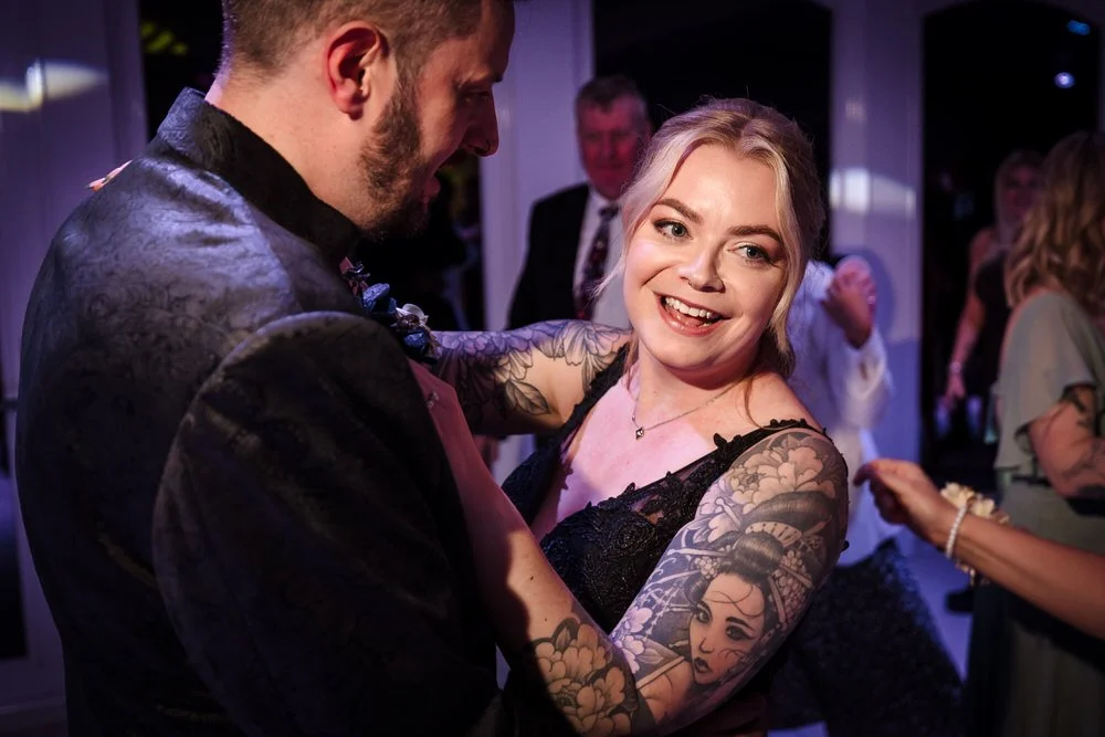 Bride smiling during first dance at Arley House wedding reception, candid moment photography by Once in a Lifetime Photography Worcestershire