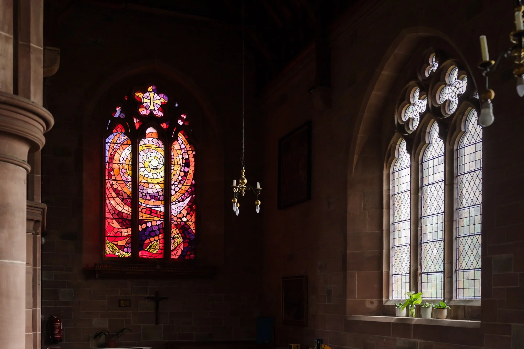 Coloured stained glass window detail inside St Bartholomew's Church, Stourport-on-Severn, ahead of the wedding ceremony.