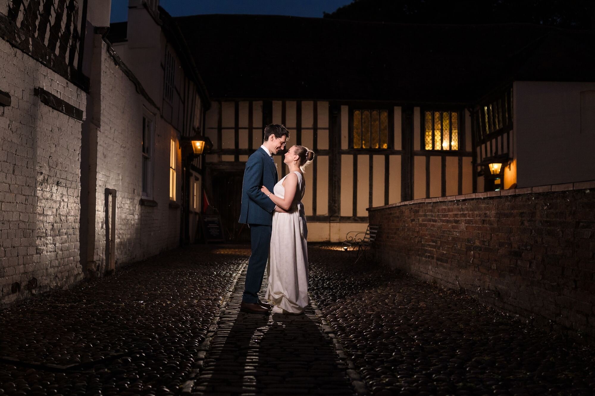 Off-camera flash night portrait of Isabelle and Chris on the cobbled courtyard at The Commandery, Worcester, by Once in a Lifetime Photography