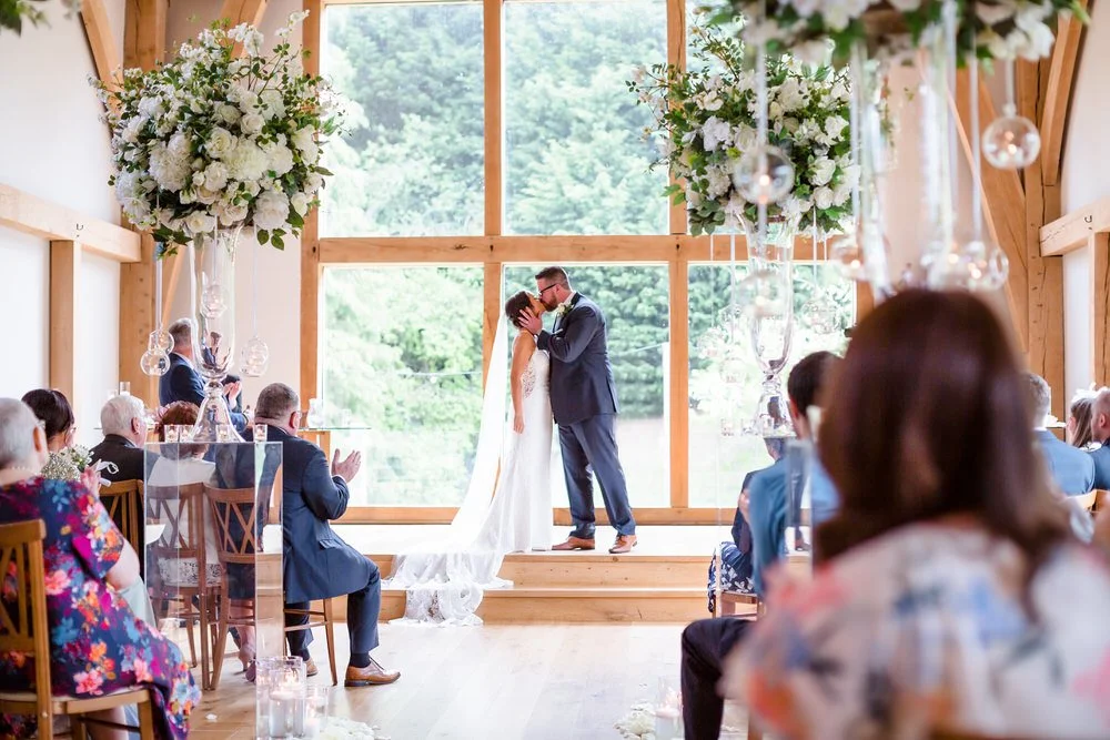bride and groom sharing a kiss