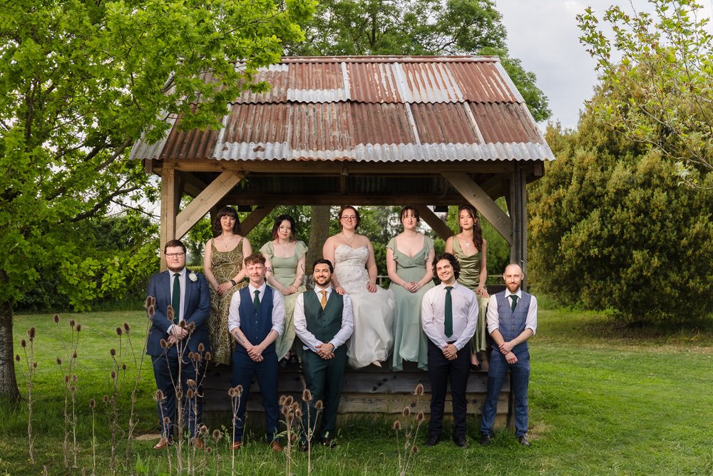 Full bridal party gathered at The Shed at Huntsmill Farm, Buckinghamshire.