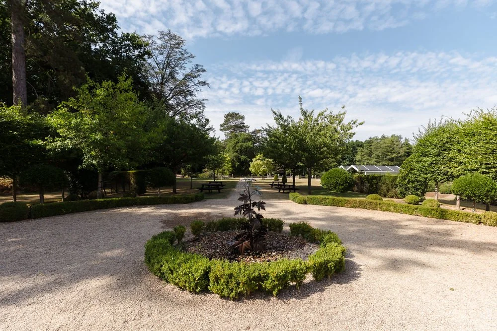 Landscaped gardens and gravel pathways at Hogarths Hotel wedding venue in Solihull.