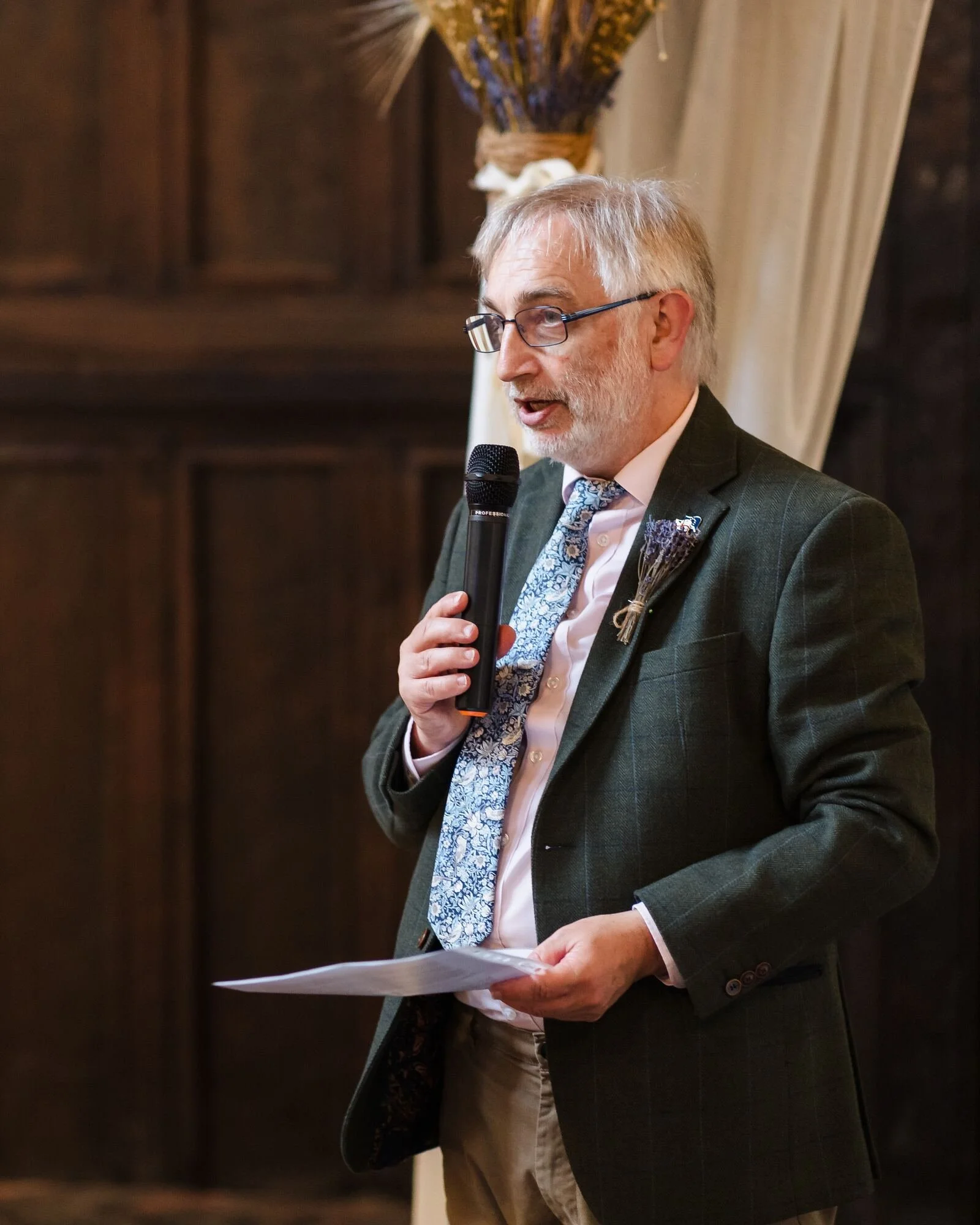 Father of the bride giving his speech against the oak panelling of the Great Hall at The Commandery, Worcester, by Once in a Lifetime Photography