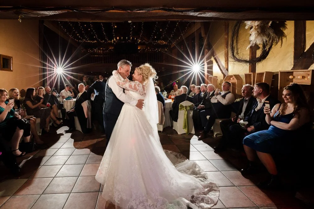 bride and father of the bride dancing at a wedding reception