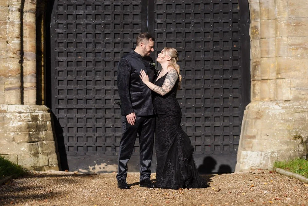 Gothic wedding couple portrait at historic Arley House entrance, creative wedding photography by Once in a lifetime Photography