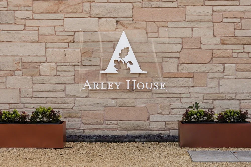 Arley House entrance sign on sandstone wall, wedding venue detail photography Worcestershire