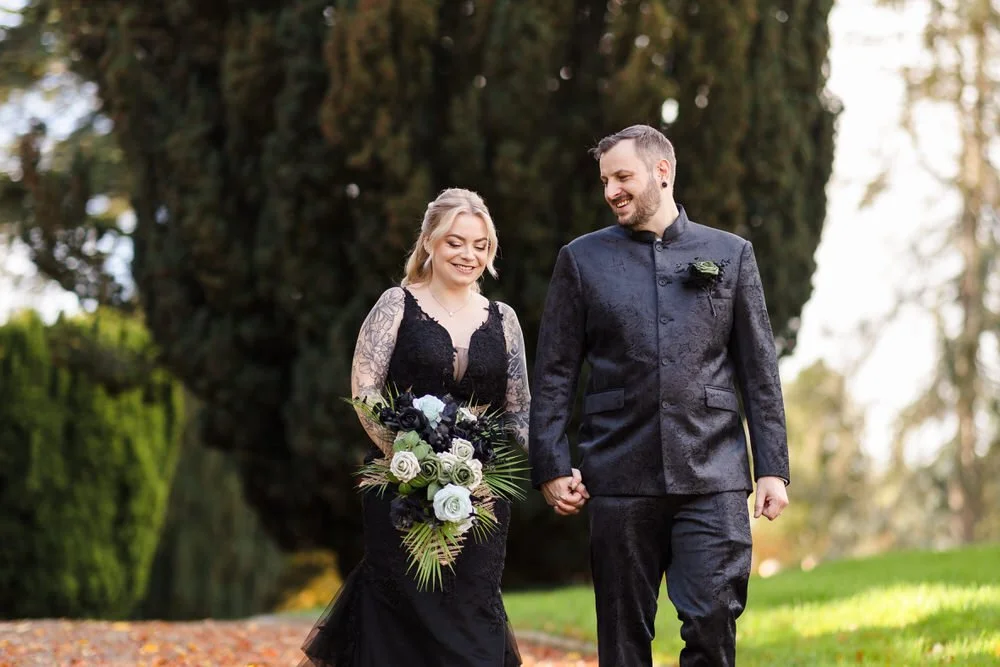 Bride and groom walking hand in hand through Arley House Gardens, autumn wedding photography Worcestershire
