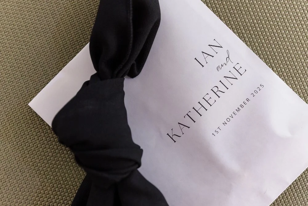 Minimalist wedding invitation with black silk ribbon for Arley House wedding, detail photography Worcestershire