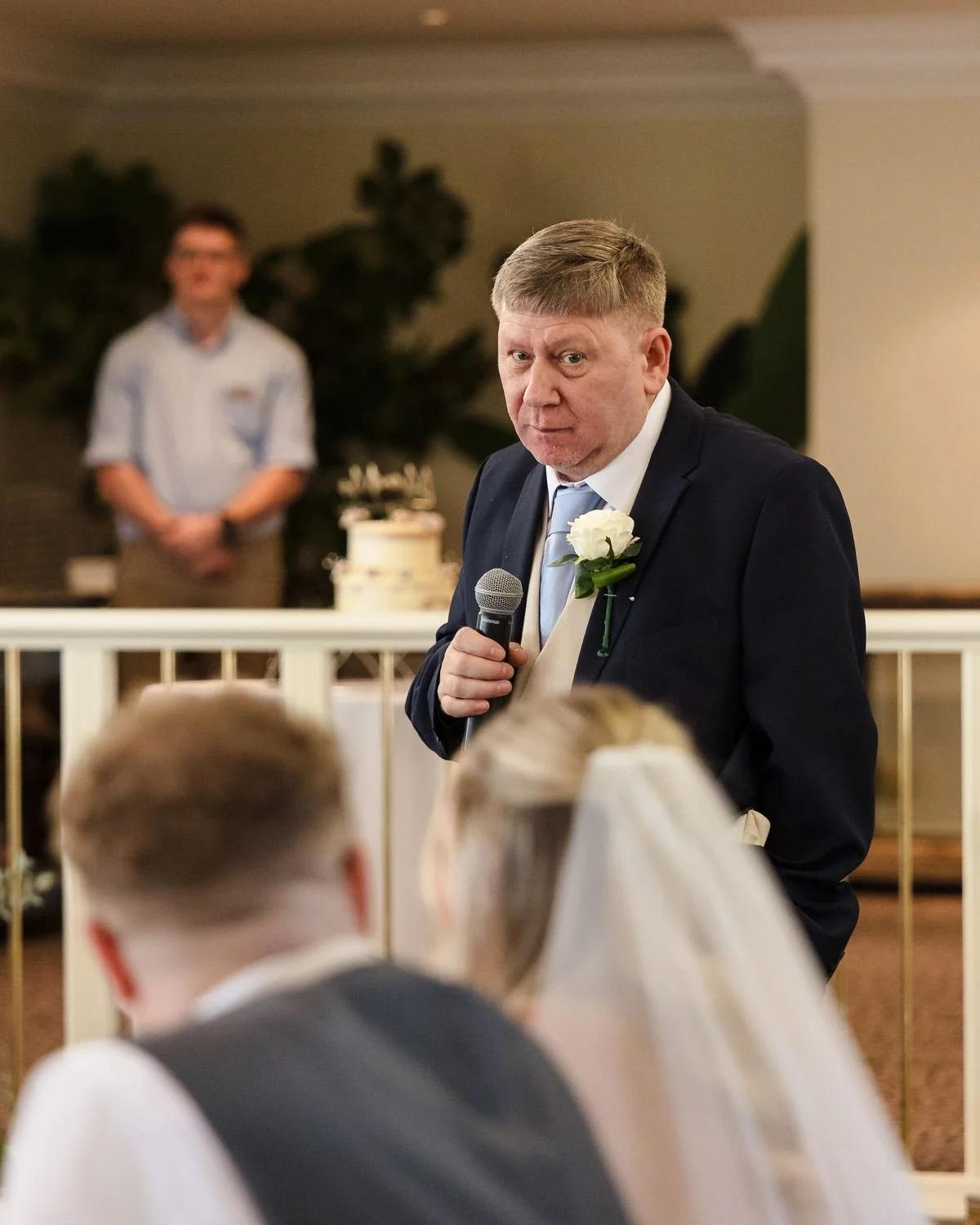 A speech in the Garden Room at Hogarths Stone Manor as Cheryl and Josh listen at the top table
