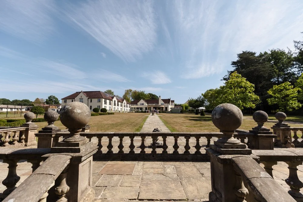 Elegant landscaped grounds and terrace at Hogarths Hotel wedding venue.