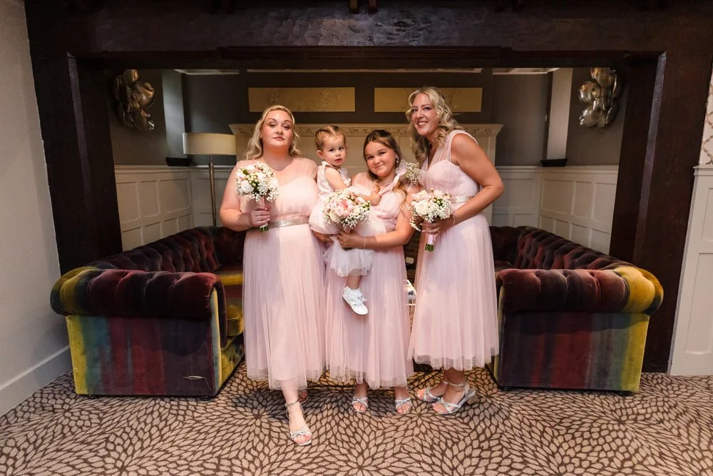 Bridesmaids and flower girl in pink dresses at Hogarths Stone Manor wedding, Once in a Lifetime Photography