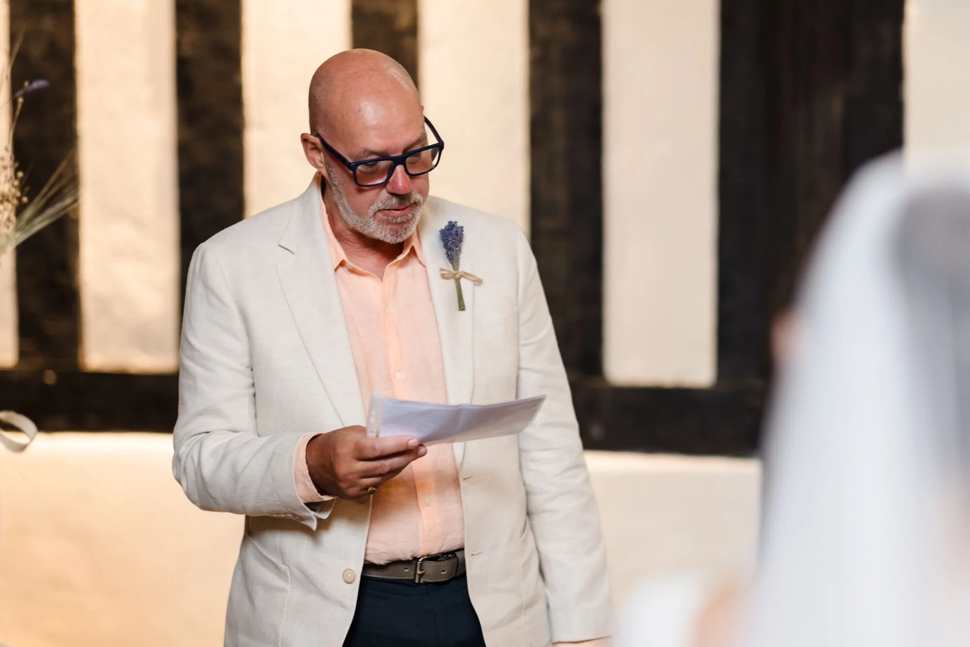 Guest giving a reading during Isabelle and Chris's wedding ceremony at The Commandery, Worcester, by Once in a Lifetime Photography