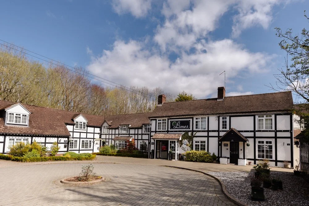 The Limes Country Lodge exterior entrance with black and white timber framing — wedding venue near Solihull photographed by Once in a Lifetime Photography