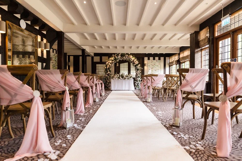 Hogarths Stone Manor Drawing Room ceremony setup with floral arch by The Wedding House Droitwich, Worcestershire wedding photography