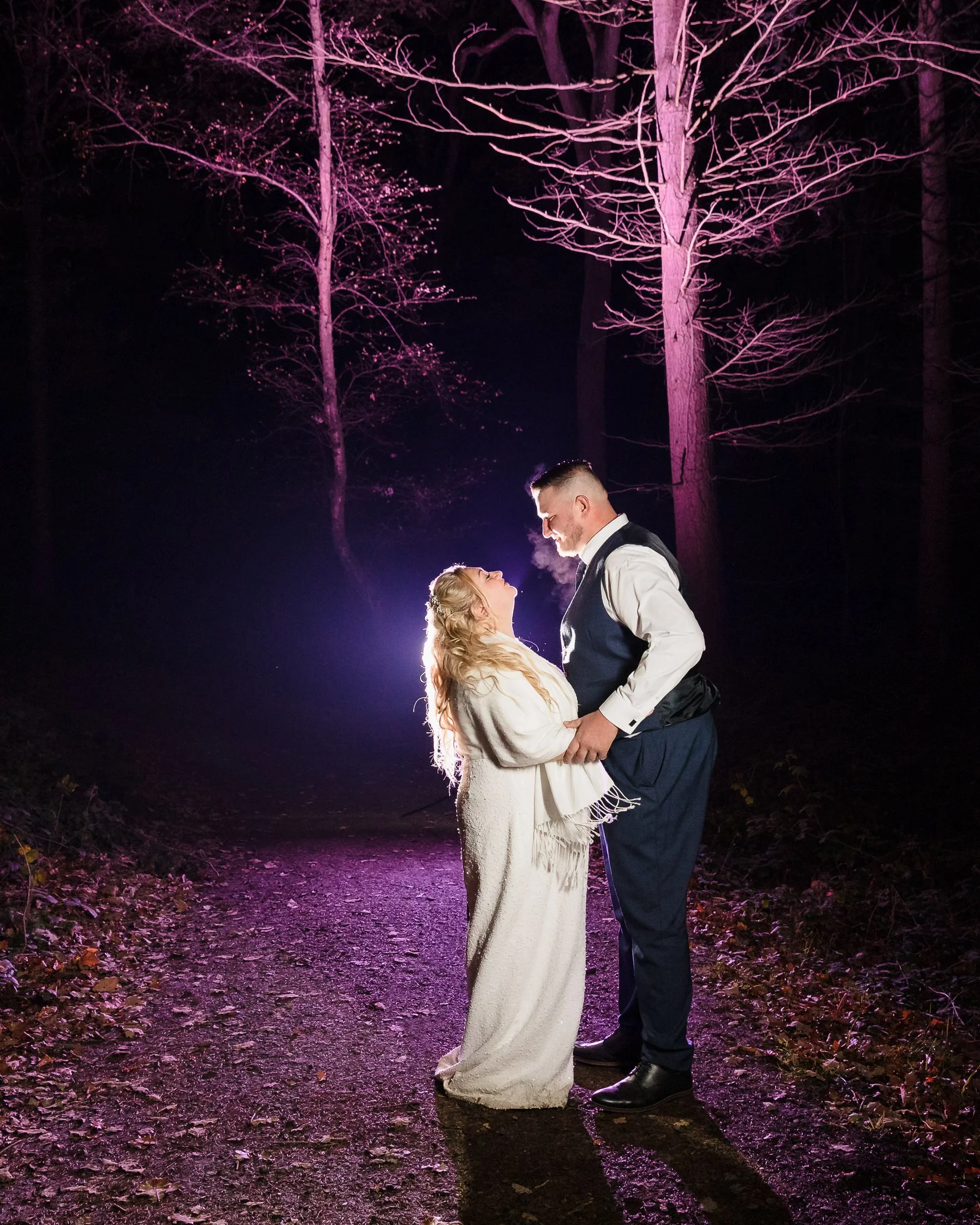 Bride and groom outside in the forest wedding