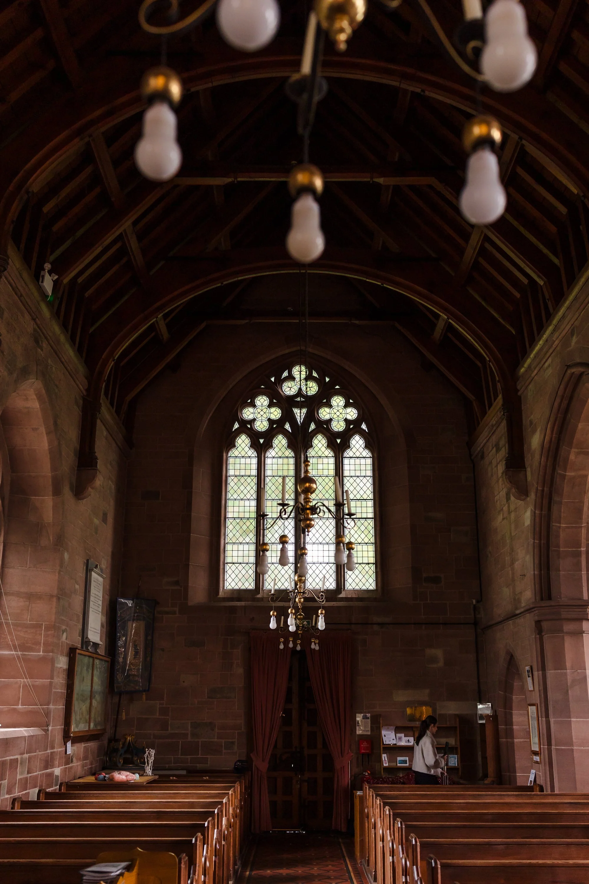Interior of St Bartholomew's Church, Stourport-on-Severn, showing the vaulted ceiling and stained glass before the wedding ceremony.