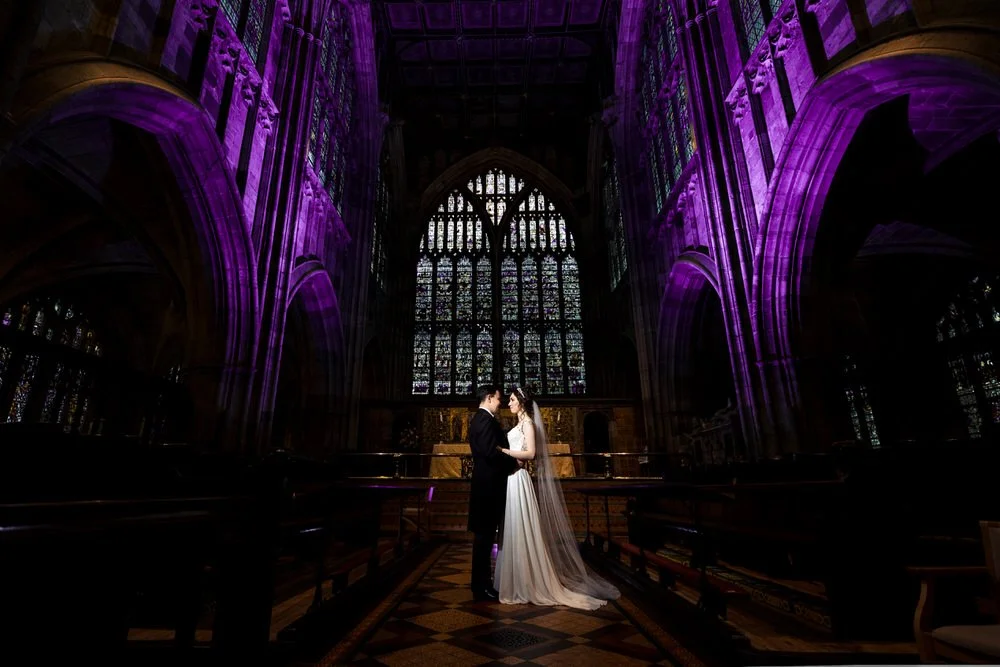 bride and groom inside Malvern Priory