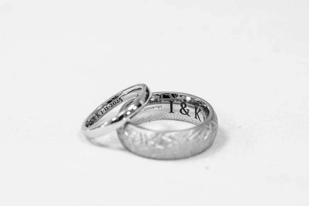 Engraved wedding bands with personalized date and initials, black and white ring detail photography by Once in a Lifetime Photography