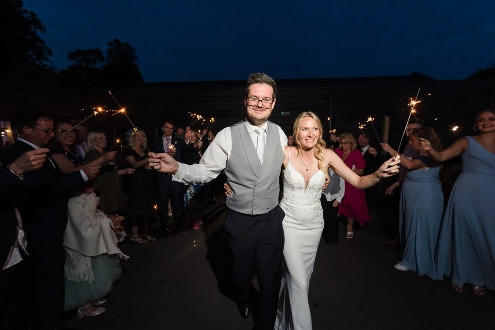 Sparkler exit celebration at Bredenbury Court Barns wedding in Herefordshire evening photography
