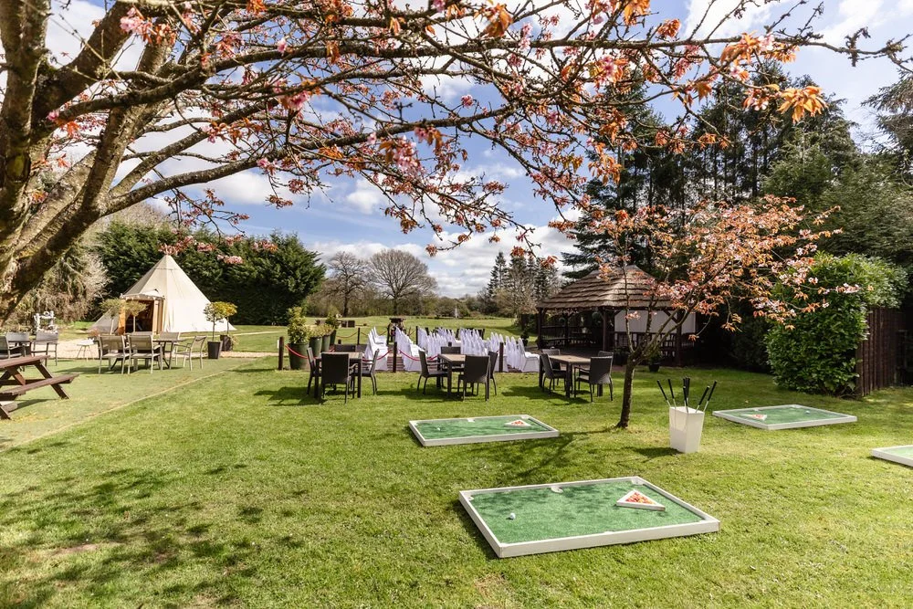 Outdoor wedding ceremony chairs set up on decking with tipi backdrop at The Limes Country Lodge, Solihull — documentary wedding photography by Once in a Lifetime Photography