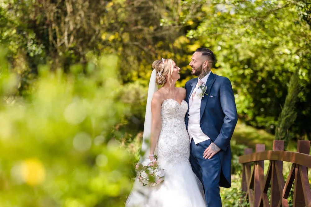 bride and laughing in the sunshine on the wedding day