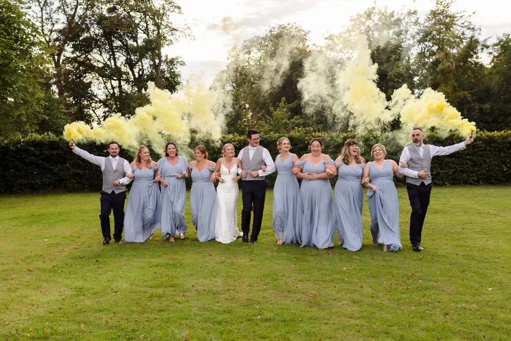 bridal party walking with smoke bombs at Birmingham Wedding.