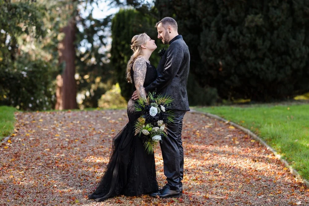 Romantic autumn wedding portrait on leaf-covered path at Arley House Gardens, natural light photography by Once in a lifetime photography Worcestershire
