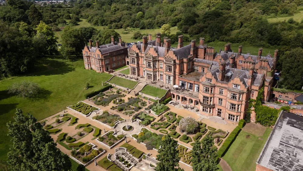 Aerial drone view of The Welcombe Hotel and its Italian Garden parterres ahead of Christine and Greg's wedding.