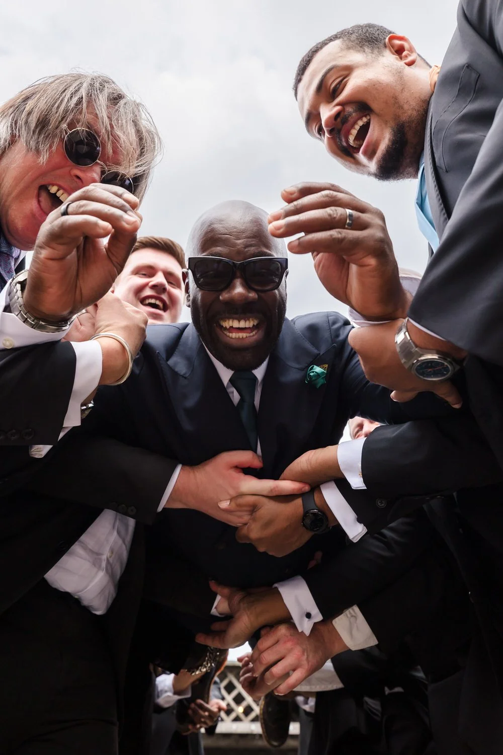 Creative groomsmen group photo The Bond Birmingham groom celebration candid fun documentary wedding photography