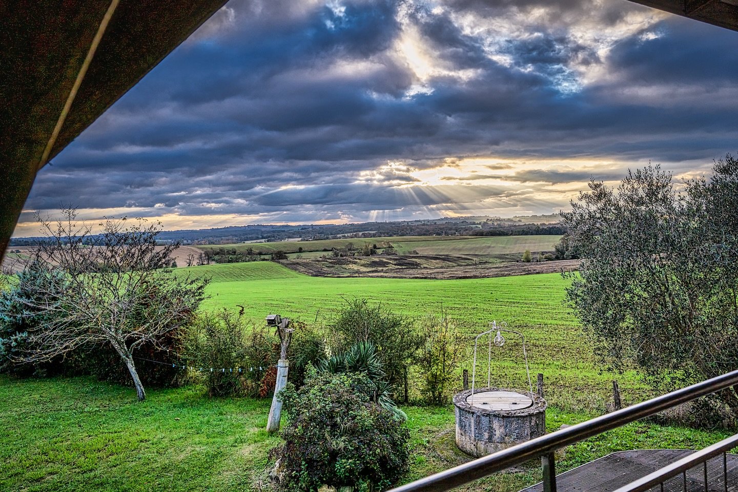Evening sun through the clouds in the distance. Only lens I have but it&rsquo;s ok! I enjoyed it more than you probably will!