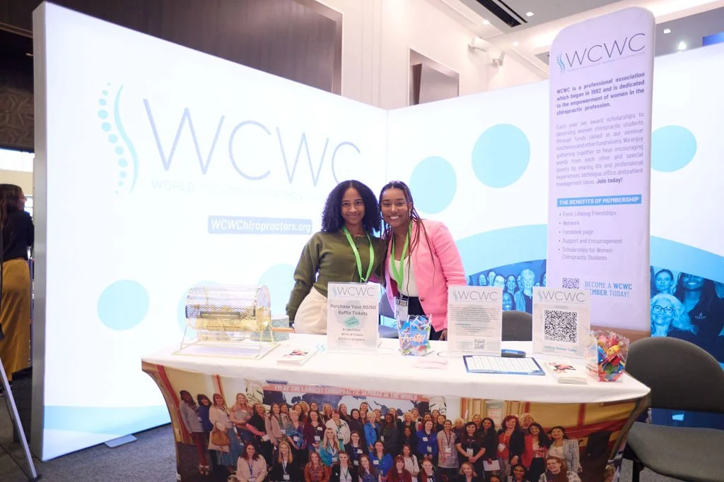 L-shaped corner booth backdrop, and fitted tall informational banner for a chiropractic seminar  