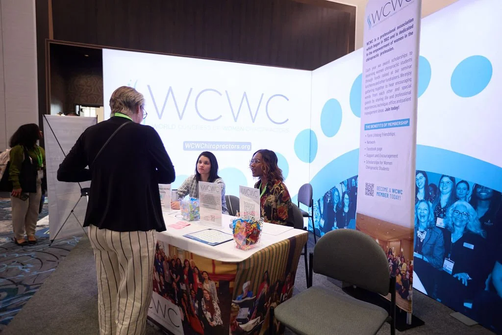 L-shaped corner booth backdrop, and fitted tall informational banner for a chiropractic seminar  