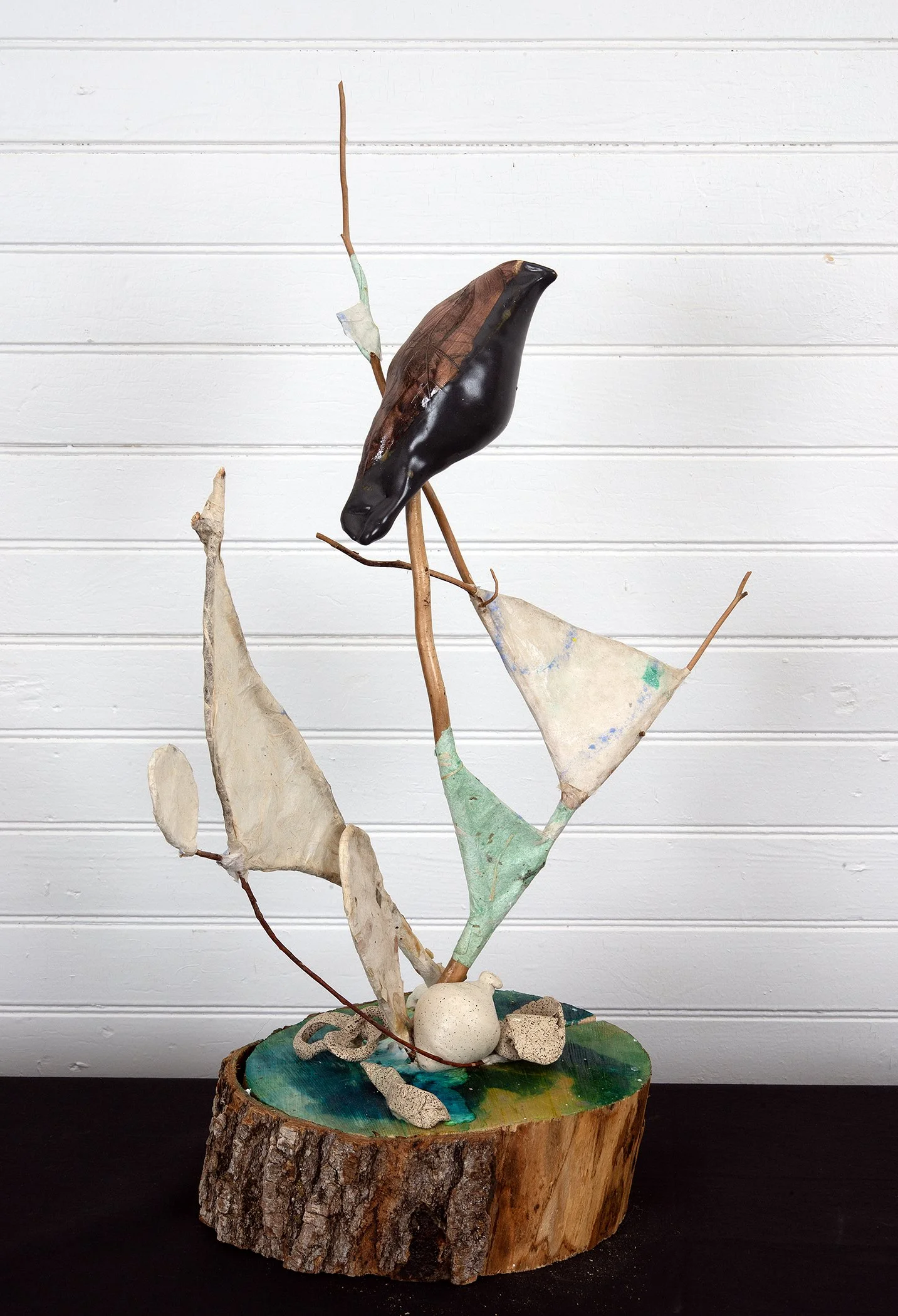 Sculpture with polished found wood, paper making and ceramics