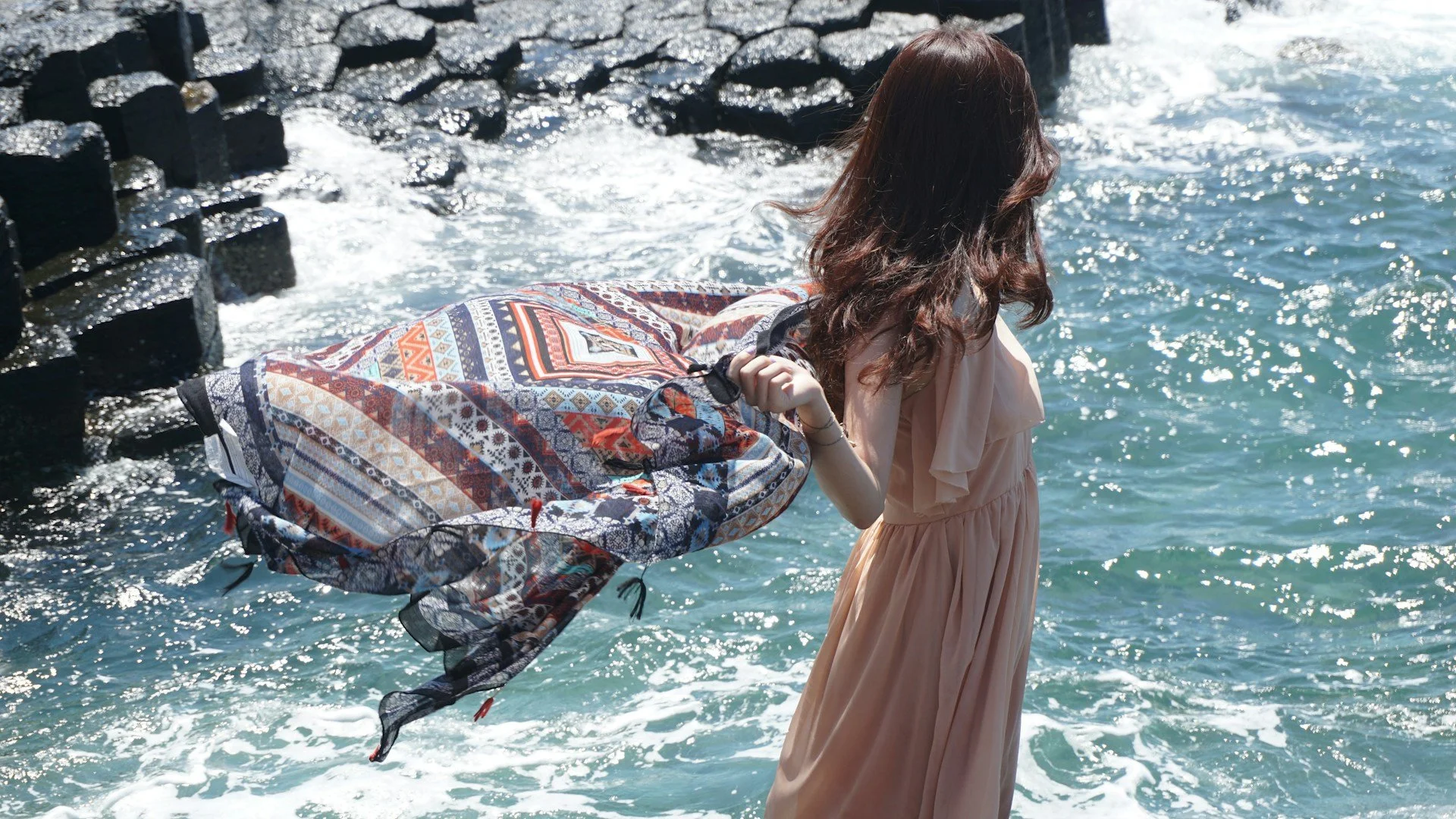 losing a scarf on a windy day at the ocean