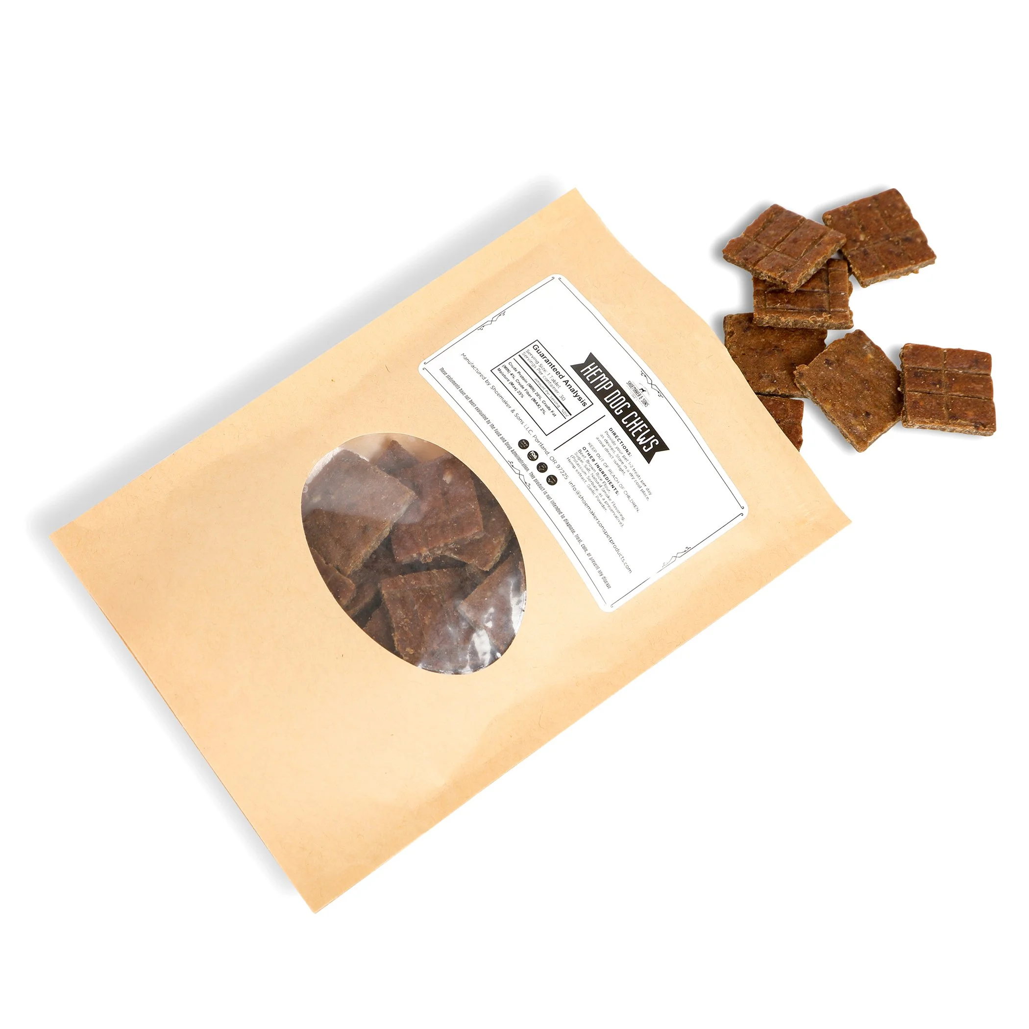 A tan package of CBD hemp dog treats lays on a white background. Treats can be seen through a plastic window on the front of the package and spill out of the top of the package. The treats are square and brown.