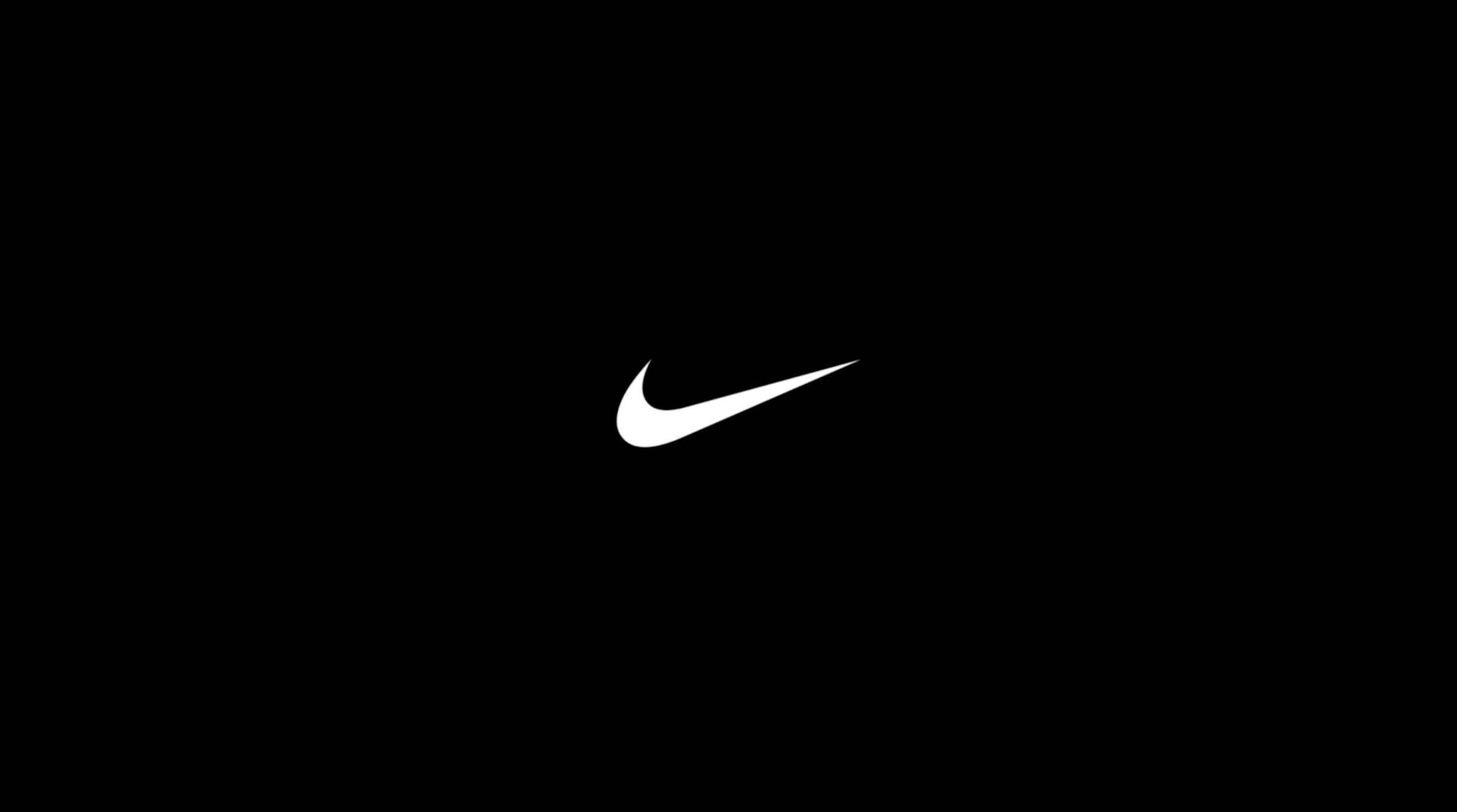 11 на черном фоне. Nike на черном фоне. Черные обои. Заставка найк. Nike логотип на черном фоне.
