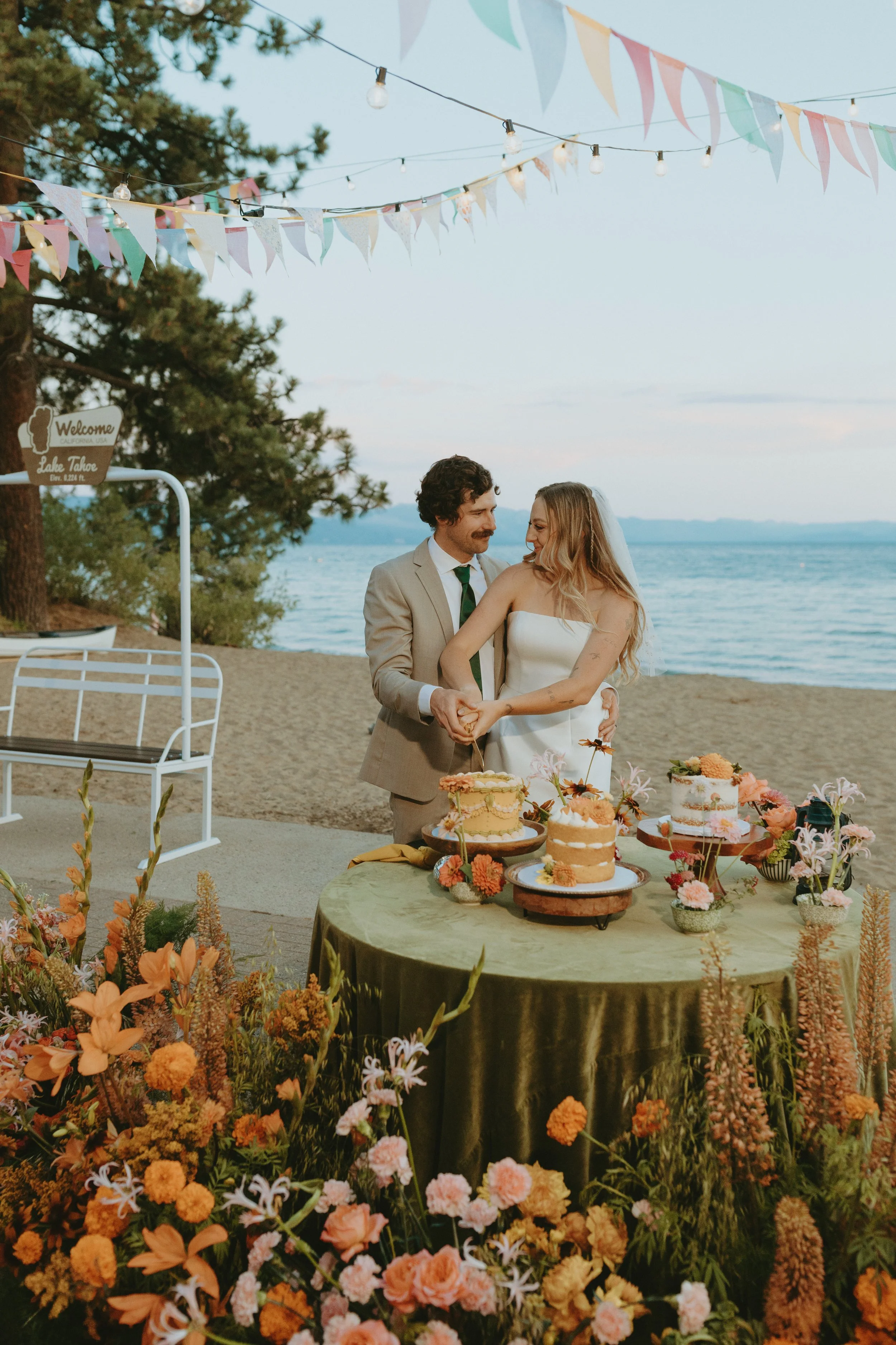 Bride and Groom cutting the cake at North Lake Tahoe Event Center