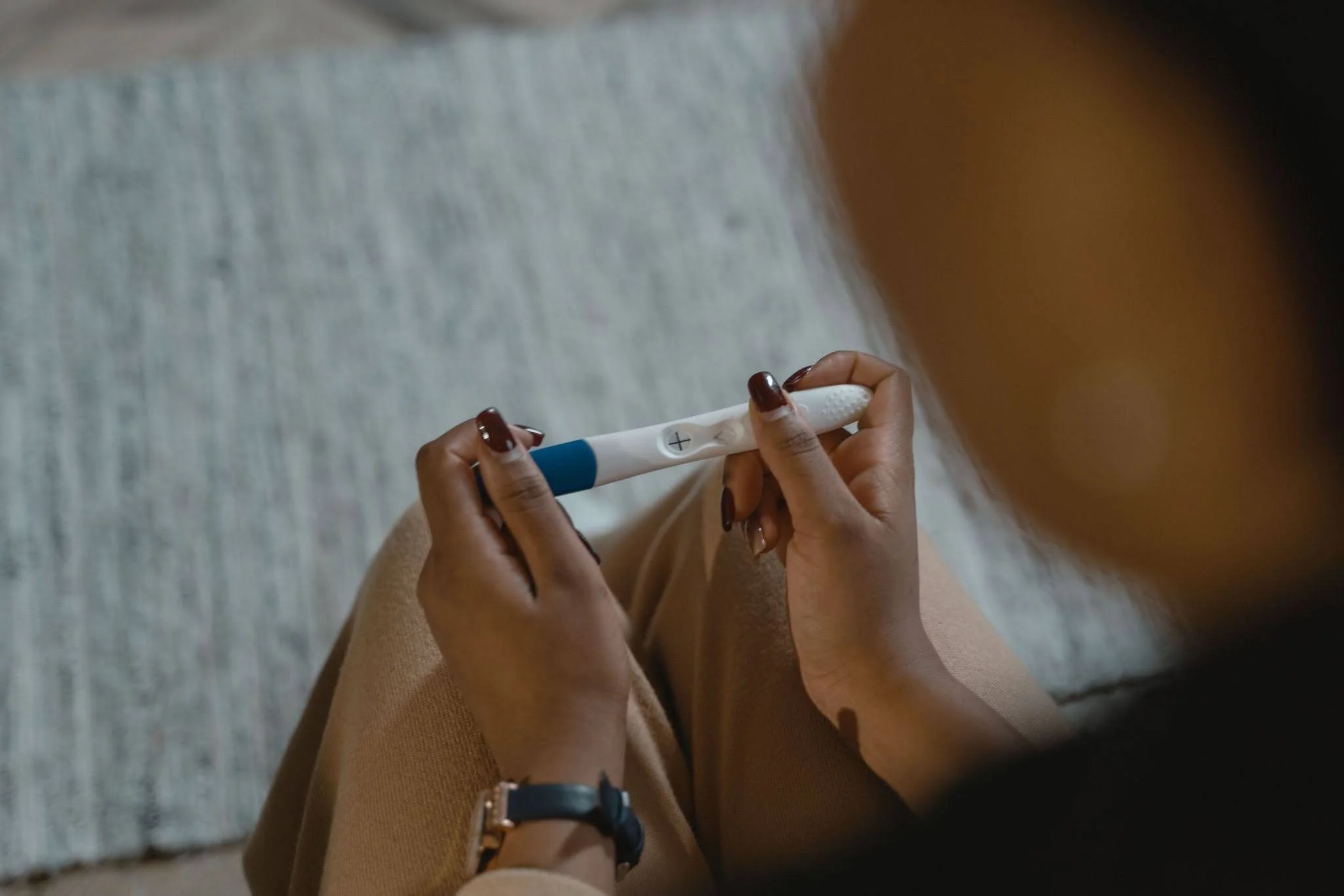 Person looking at pregnancy test