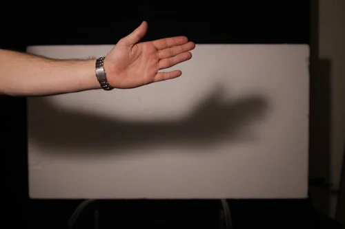 My 800W redhead is now shining through a sheet of heavy diffusion. Whilst the shadow is still quite prominent, it is far softer than before. If I wanted to soften it further I could either move my hand closer to the light or move the diffusion close…