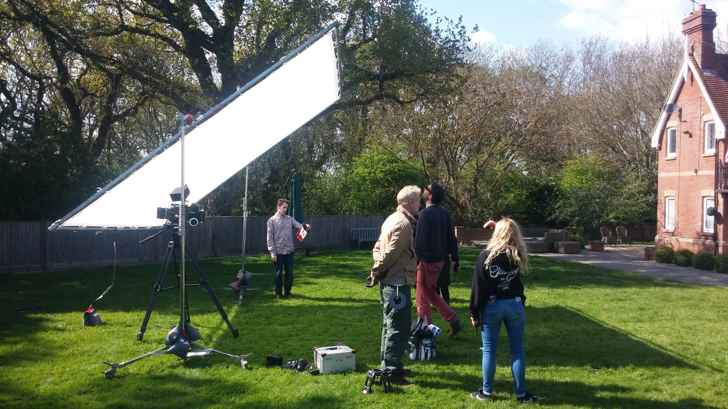 On set with Substantial Films; on this bright day a huge trace frame (or silk) was used to soften the harshness of the sun. Because our shot involved two actors we needed to diffuse a large area.