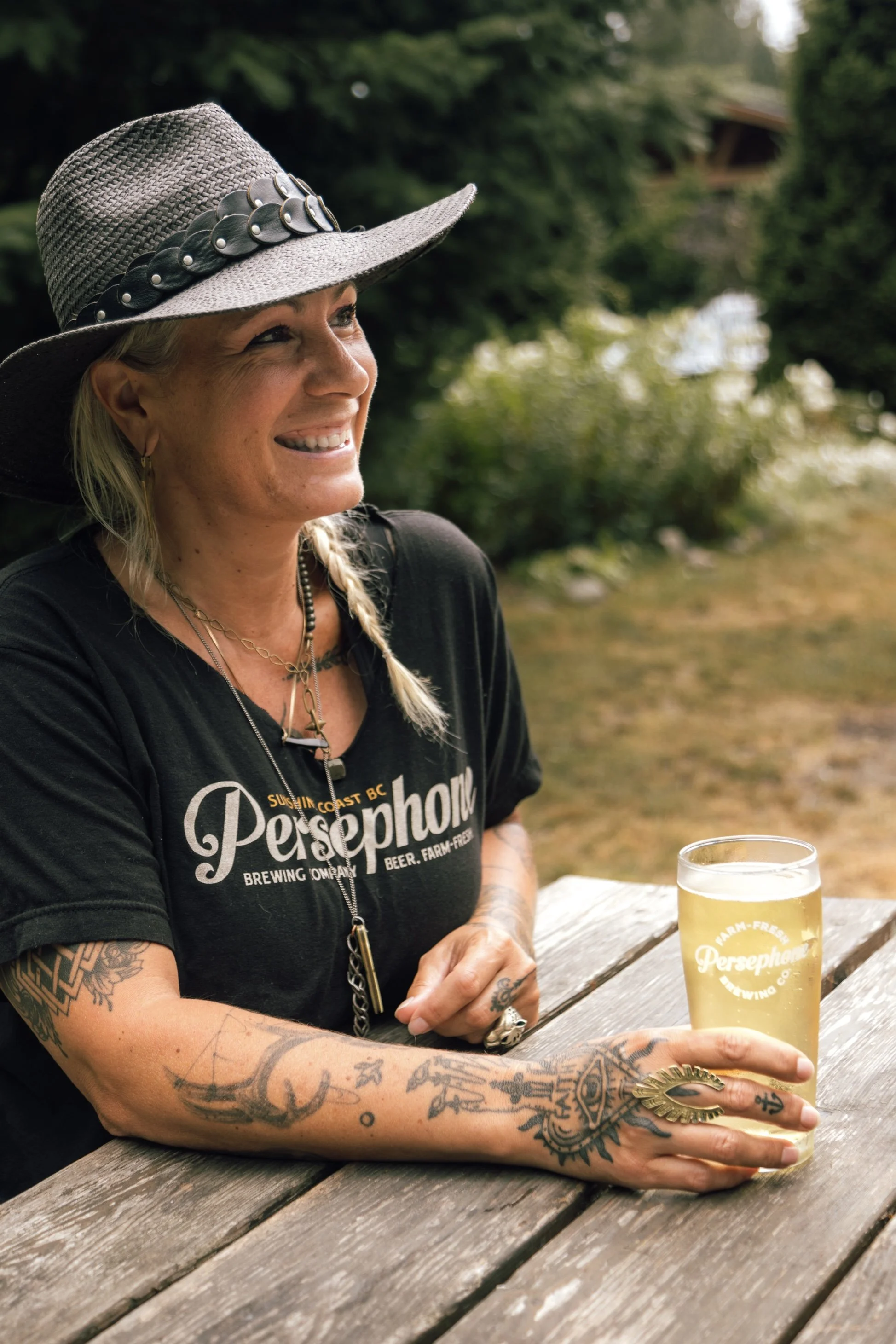 Persephone Brand Manager enjoying a craft brew on the patio.