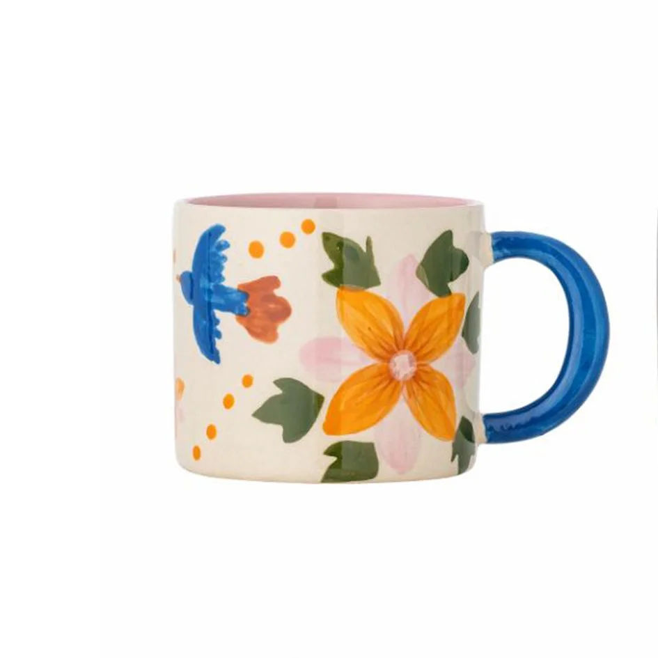 Κούπα με πορτοκαλί λουλούδια και μπλε πουλάκι