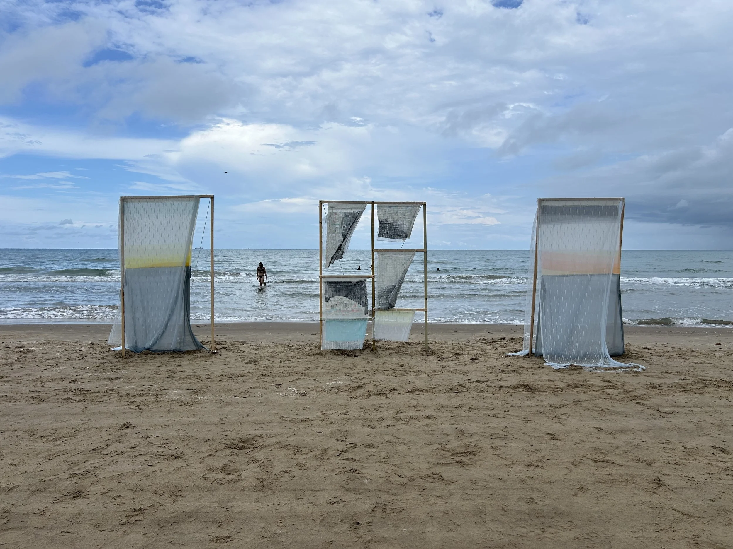 Installation featuring three panels with fabric at Boca Chica Beach