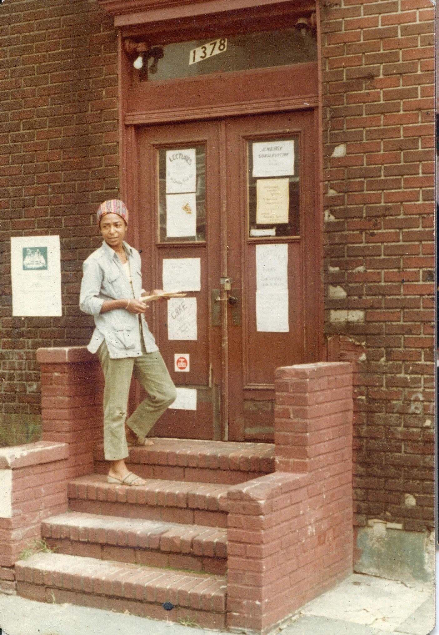 Bronx educator/activist Hetty Fox standing in front of a South Bronx community center. Courtesy of Decade of Fire .