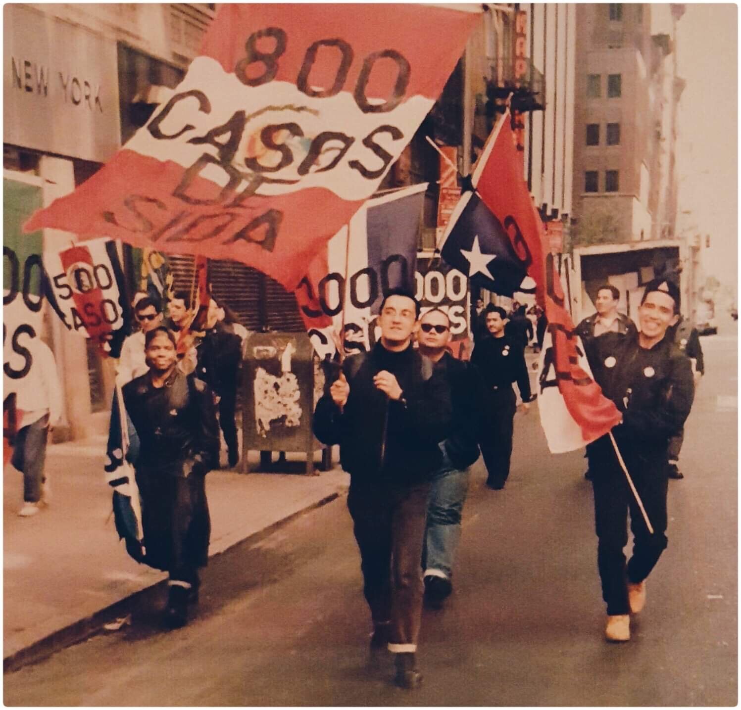  ACT Up Americas’ permit to march at the 1991 Hispanic Day Parade was granted but then revoked at the last minute. The activists decided to march alongside the parade carrying large flags of Latin American countries—Peru, Mexico, Honduras, Venezuela,