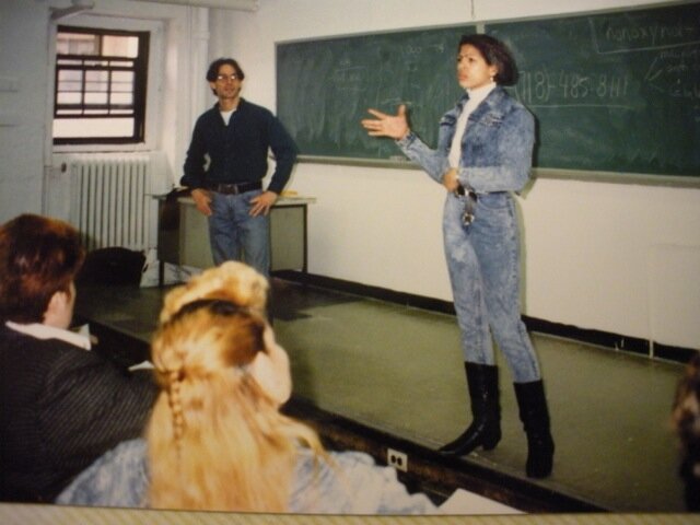  The Latina/o Caucus focused on outreach and education in NYC's Latino communities. when the norm was silence and stigma. Pictured, the late Lydia Awadallah and Luis Santiago speaking in a classroom. Awadallah was a tireless advocate for women's issu
