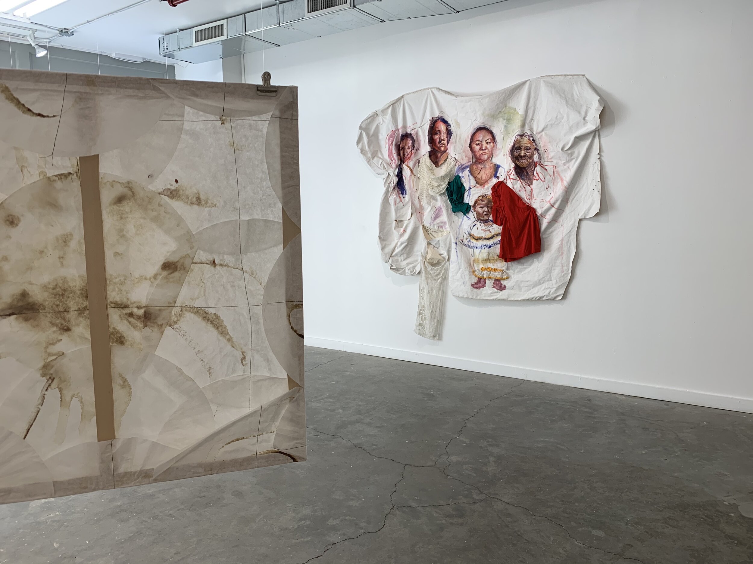  Gallery view of  Familia Bloodline,  2018 (right) from viewpoint of  Limpieza de Sangre , 2015-2016 (left). Image courtesy of Maya Ortiz Saucedo. 